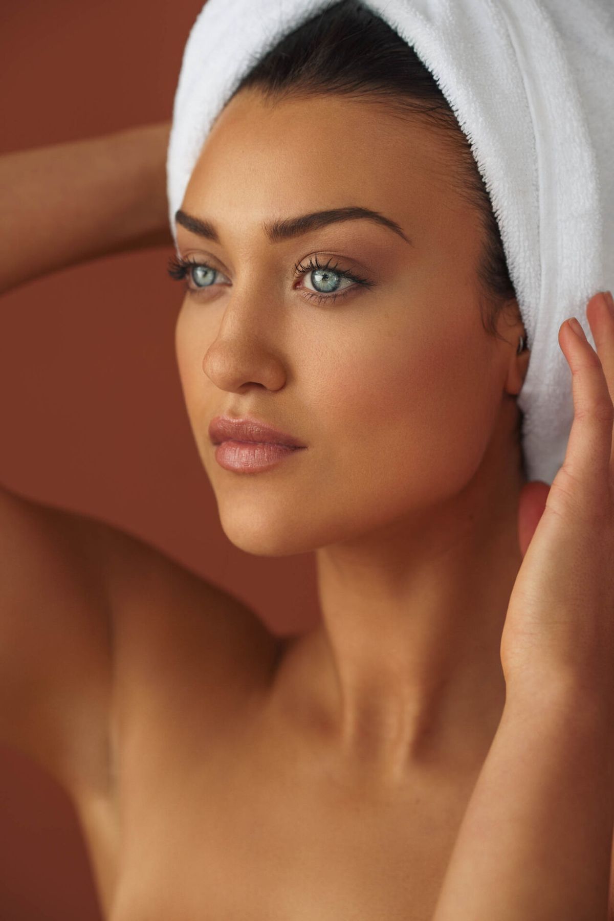Client with a towel wrap after a facial